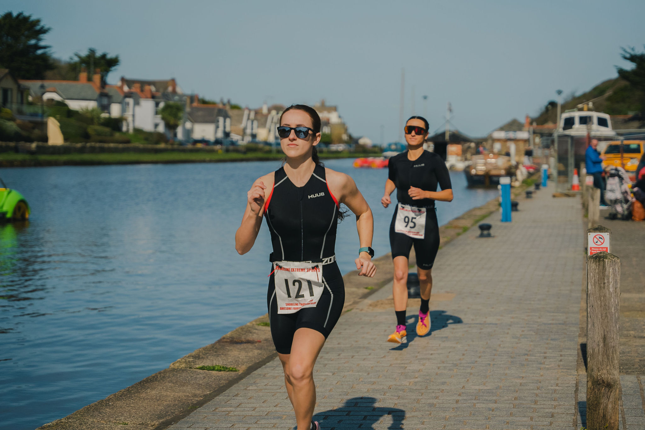 Two runners next to canal triathlon and quadrathlon